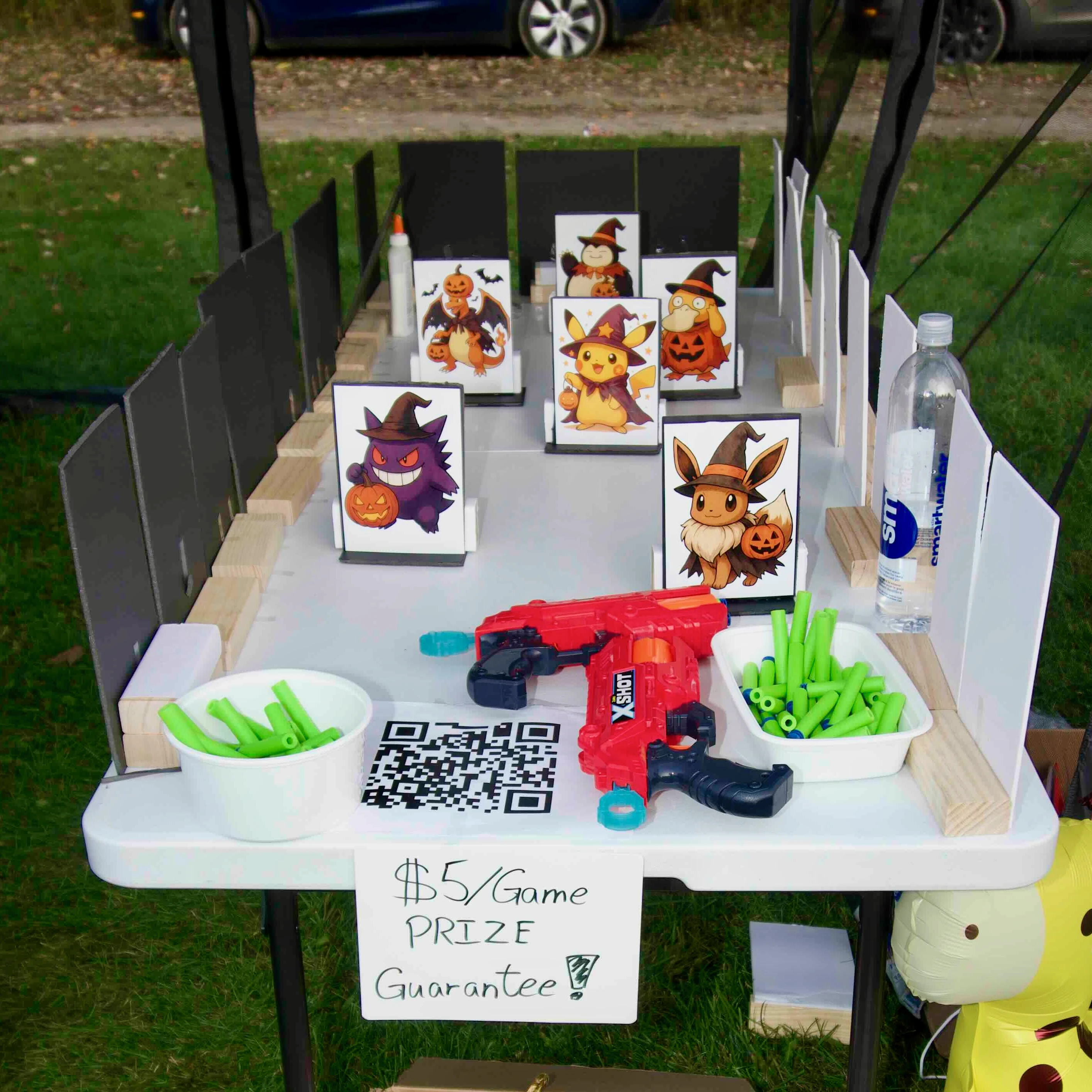 Pokemon-themed Nerf target booth setup at a festival